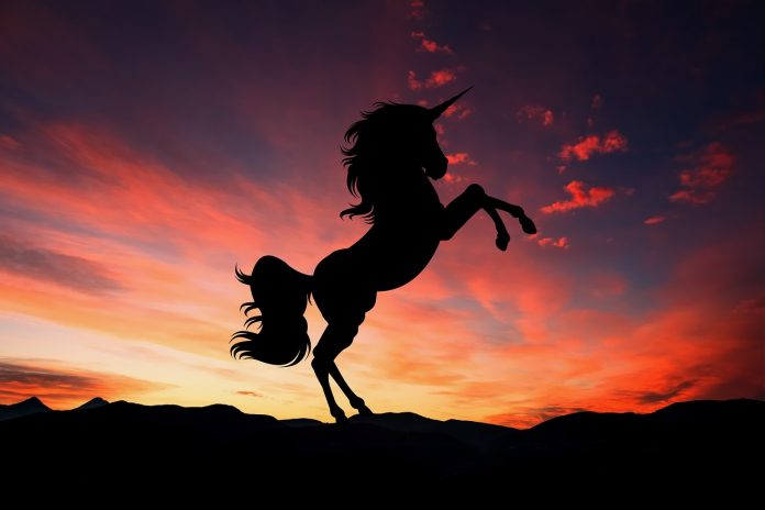 silhouette of a unicorn against twilight sky